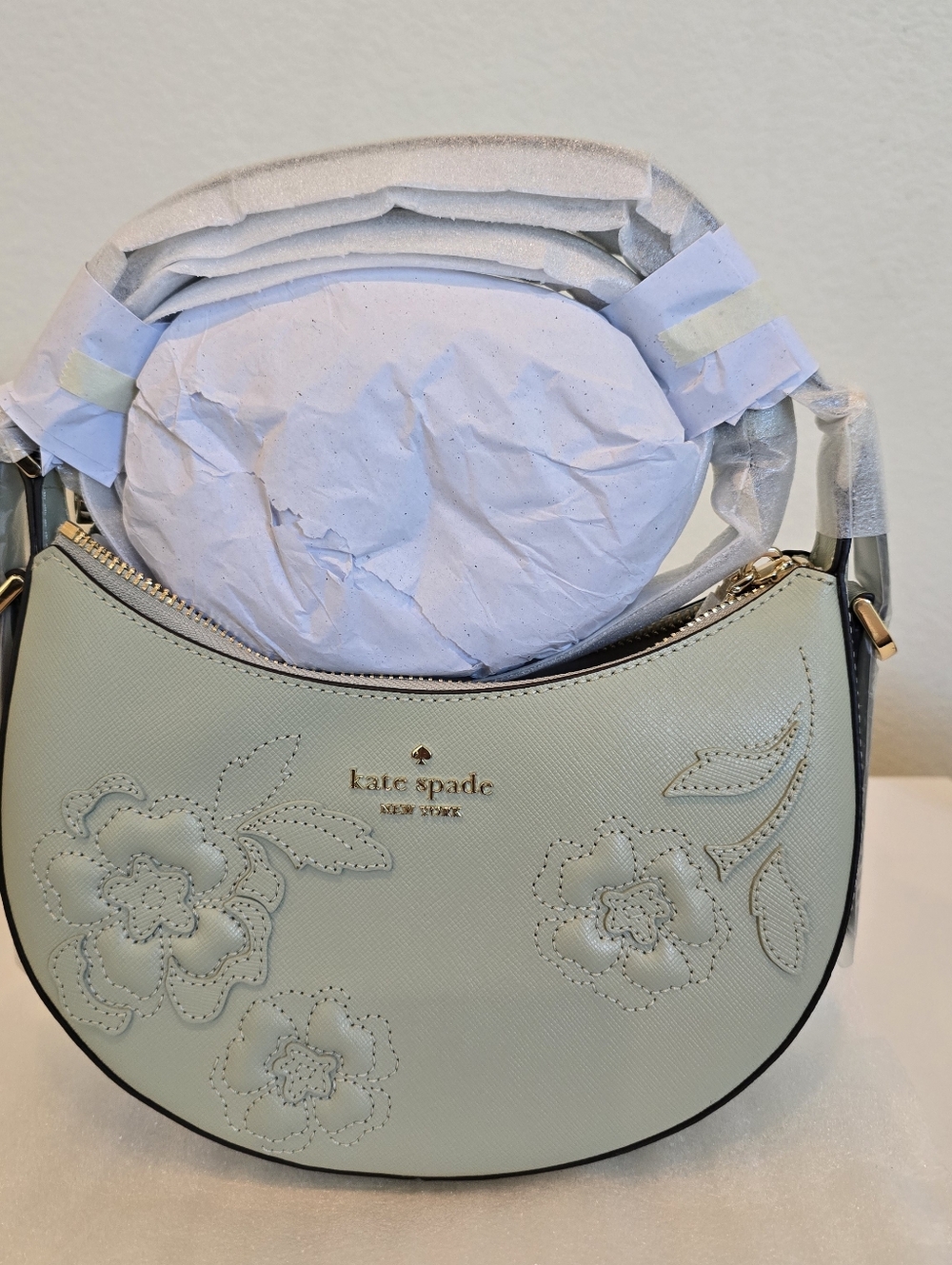 The Kate Spade Nova Floral Applique Crescent Shoulder Bag